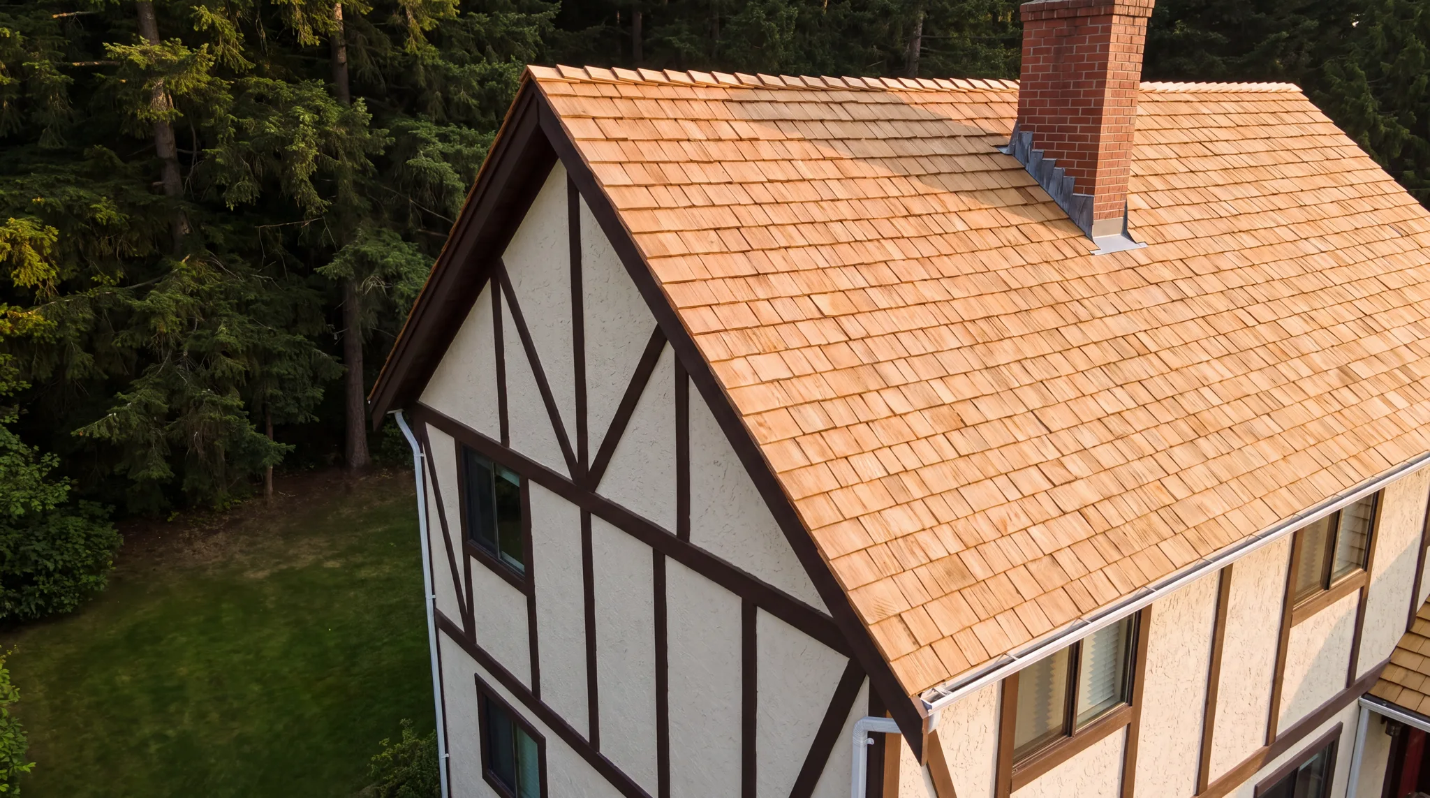 The same Tudor-style house with a brand-new cedar shake roof
